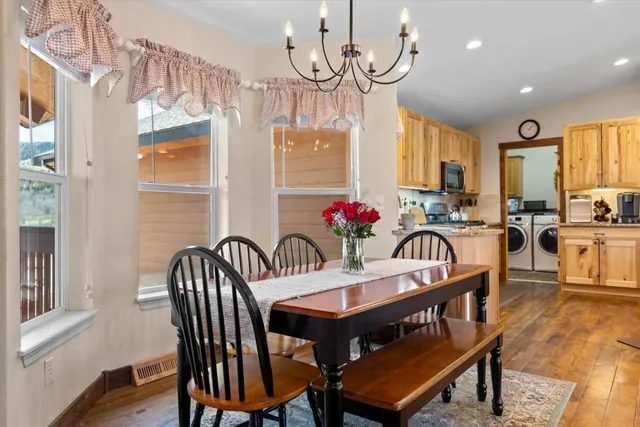 a view of a dining room with furniture window and wooden floor