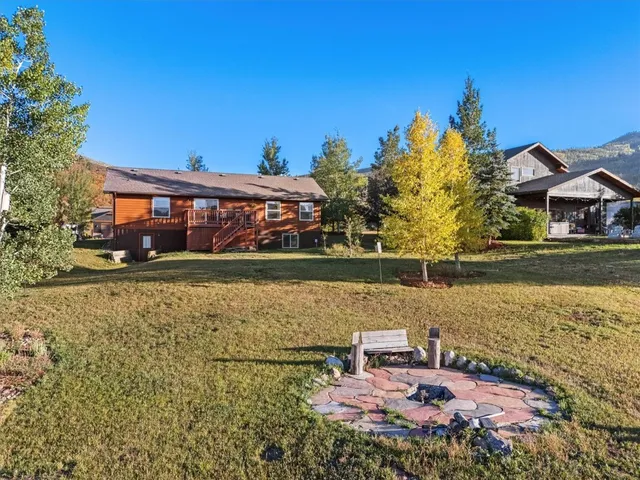 a view of a lake with a house in the background