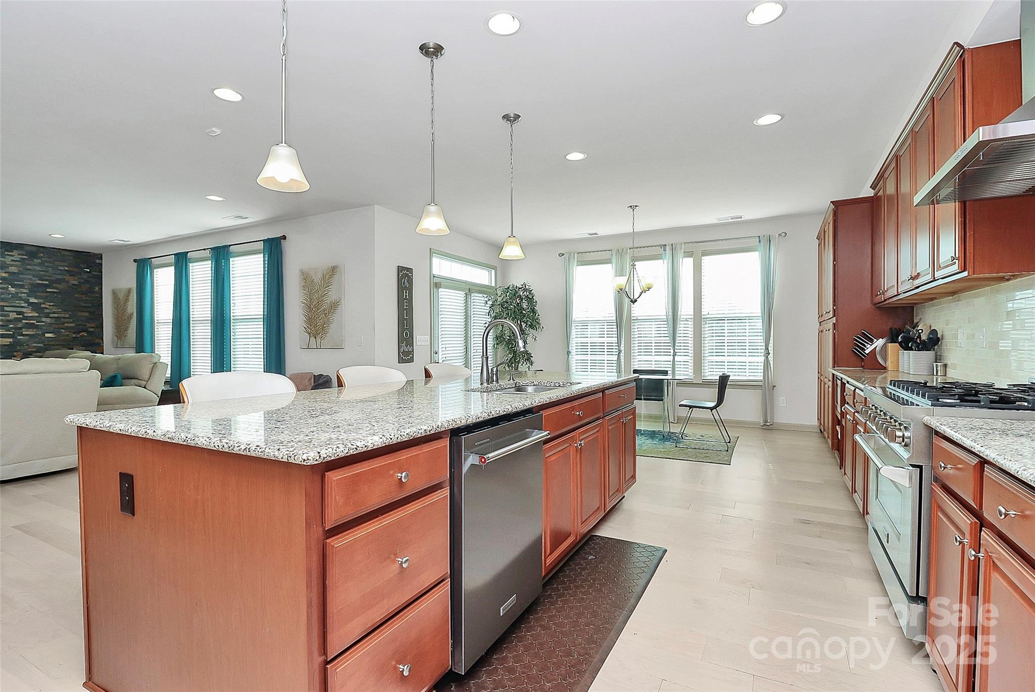 7362 Millstone Circle Southwest Concord, NC 28025 - Photo 11 of 45 a large kitchen with kitchen island a large island in it