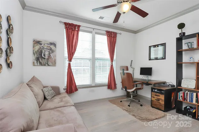 a work room with furniture and a window