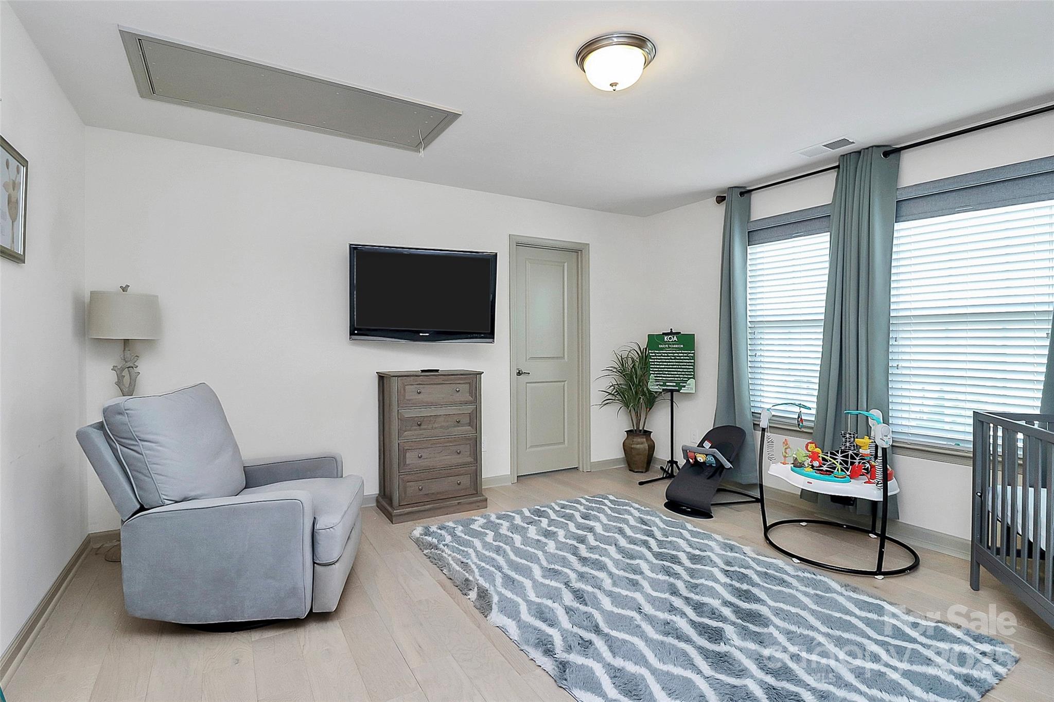 7362 Millstone Circle Southwest Concord, NC 28025 - Photo 20 of 45 a living room with furniture and a flat screen tv