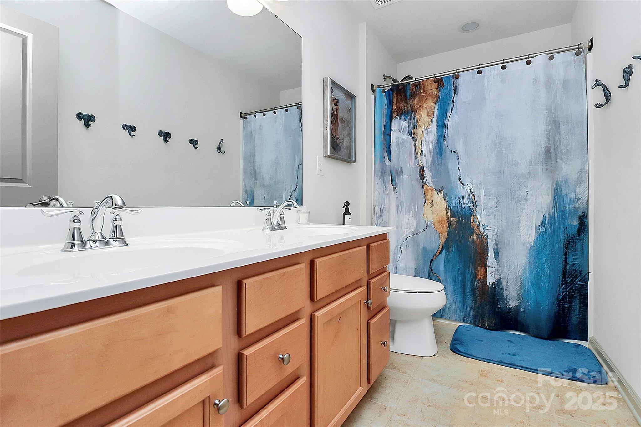 7362 Millstone Circle Southwest Concord, NC 28025 - Photo 23 of 45 a bathroom with a double vanity sink mirror and toilet