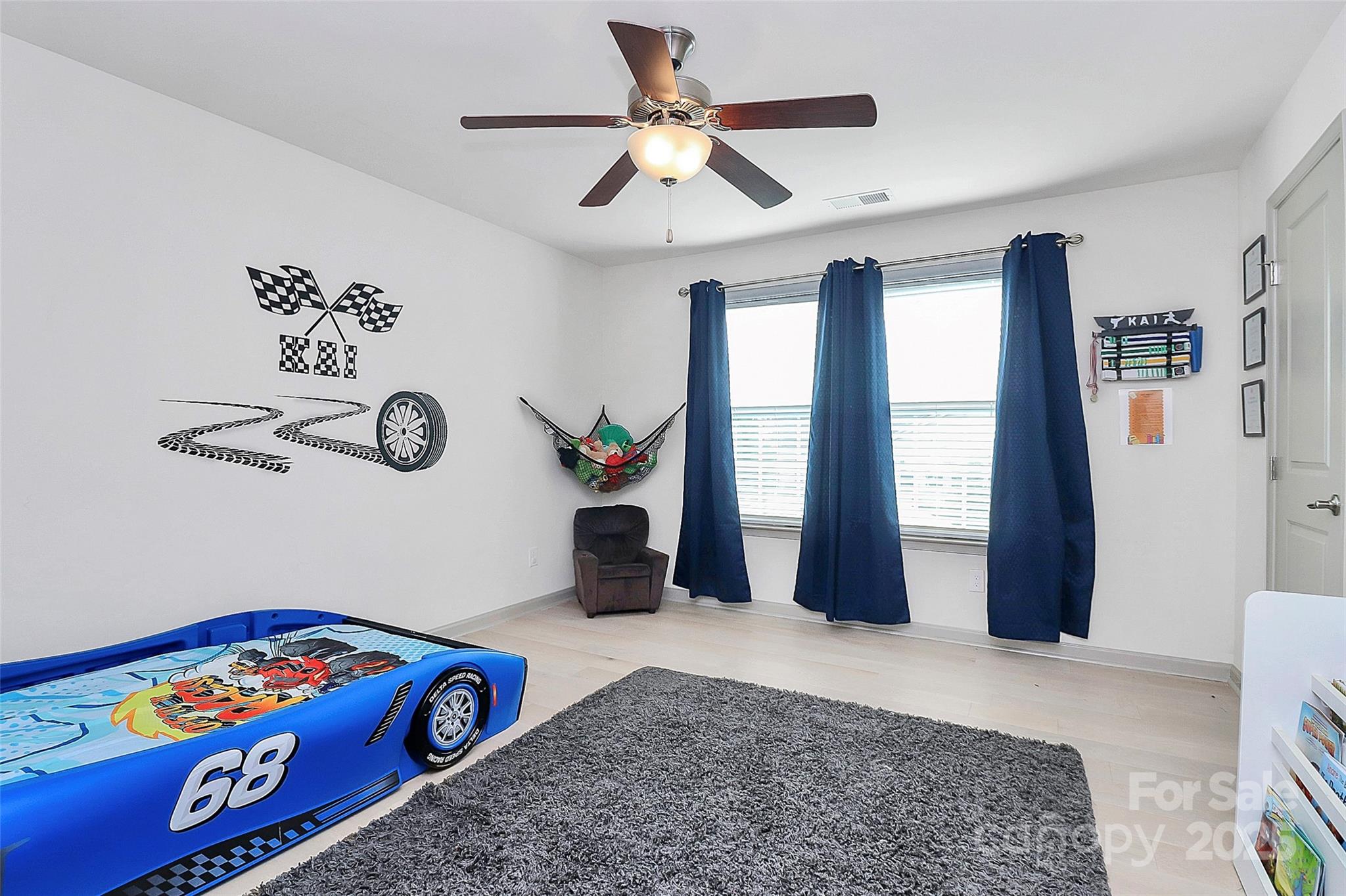 7362 Millstone Circle Southwest Concord, NC 28025 - Photo 24 of 45 a bedroom with a bed and a large window