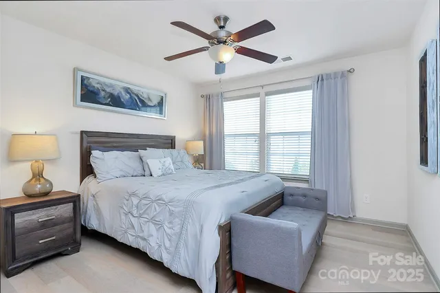 a bedroom with a bed and window