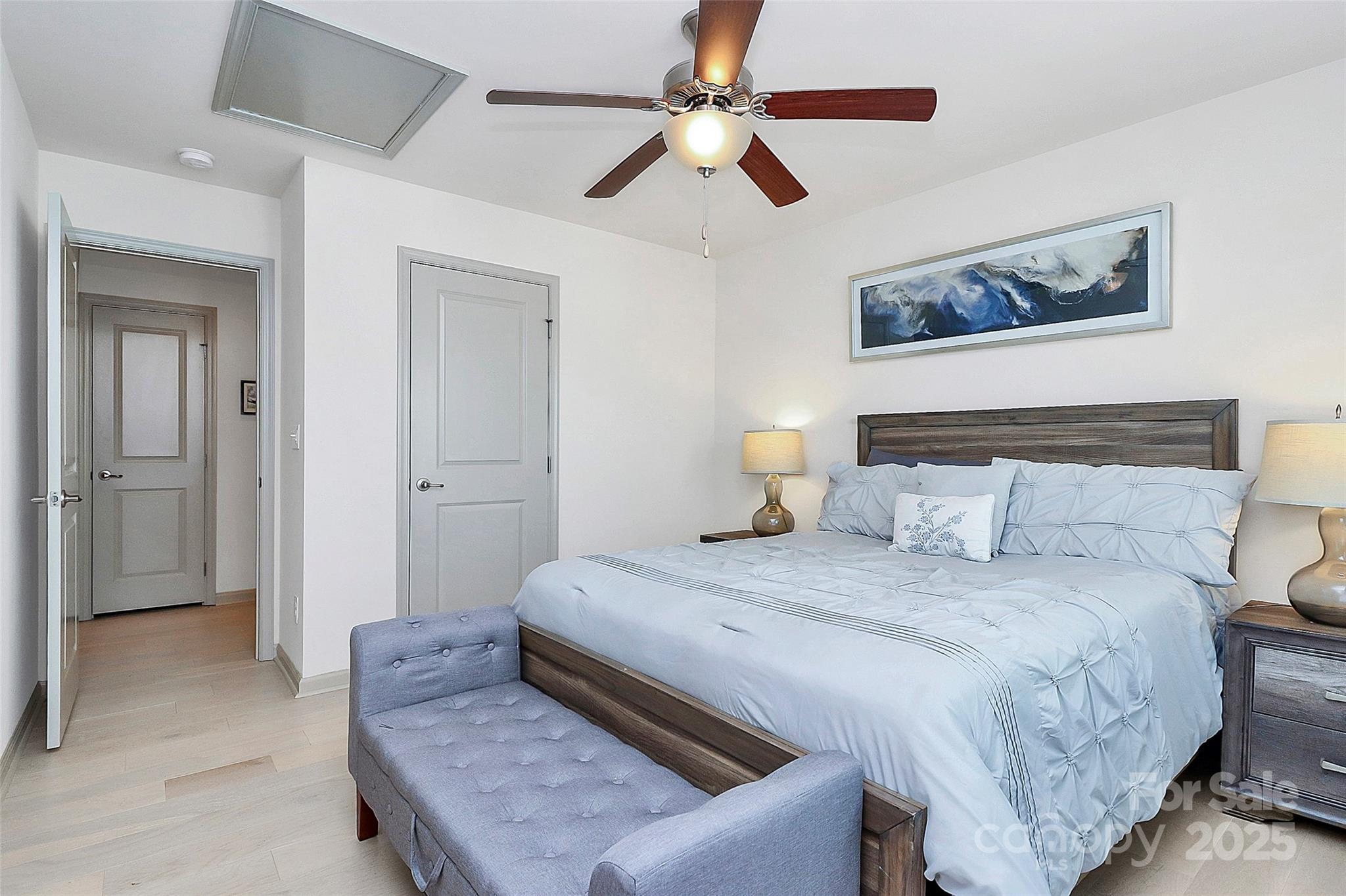 7362 Millstone Circle Southwest Concord, NC 28025 - Photo 28 of 45 a bedroom with a bed and a chandelier