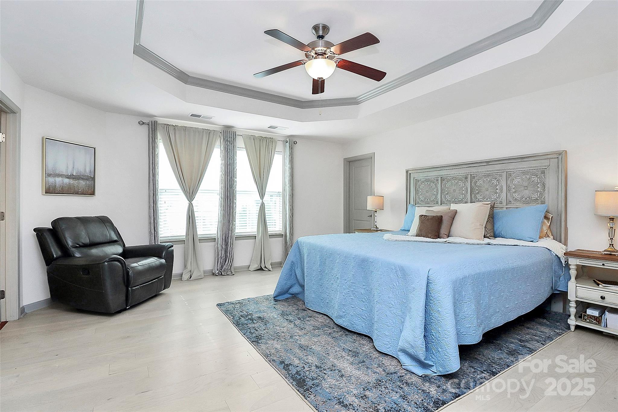 7362 Millstone Circle Southwest Concord, NC 28025 - Photo 29 of 45 a spacious bedroom with a bed and couch