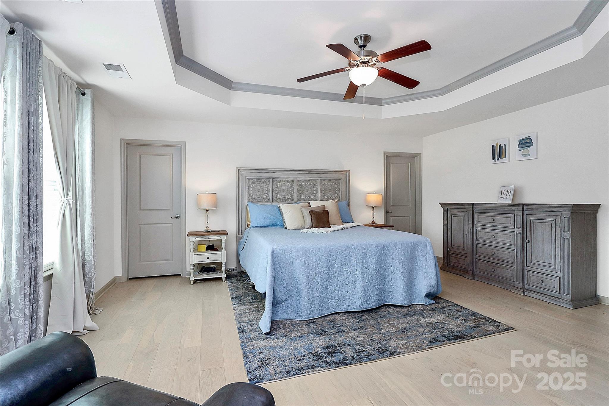 7362 Millstone Circle Southwest Concord, NC 28025 - Photo 35 of 45 a bedroom with a bed a window and a couch