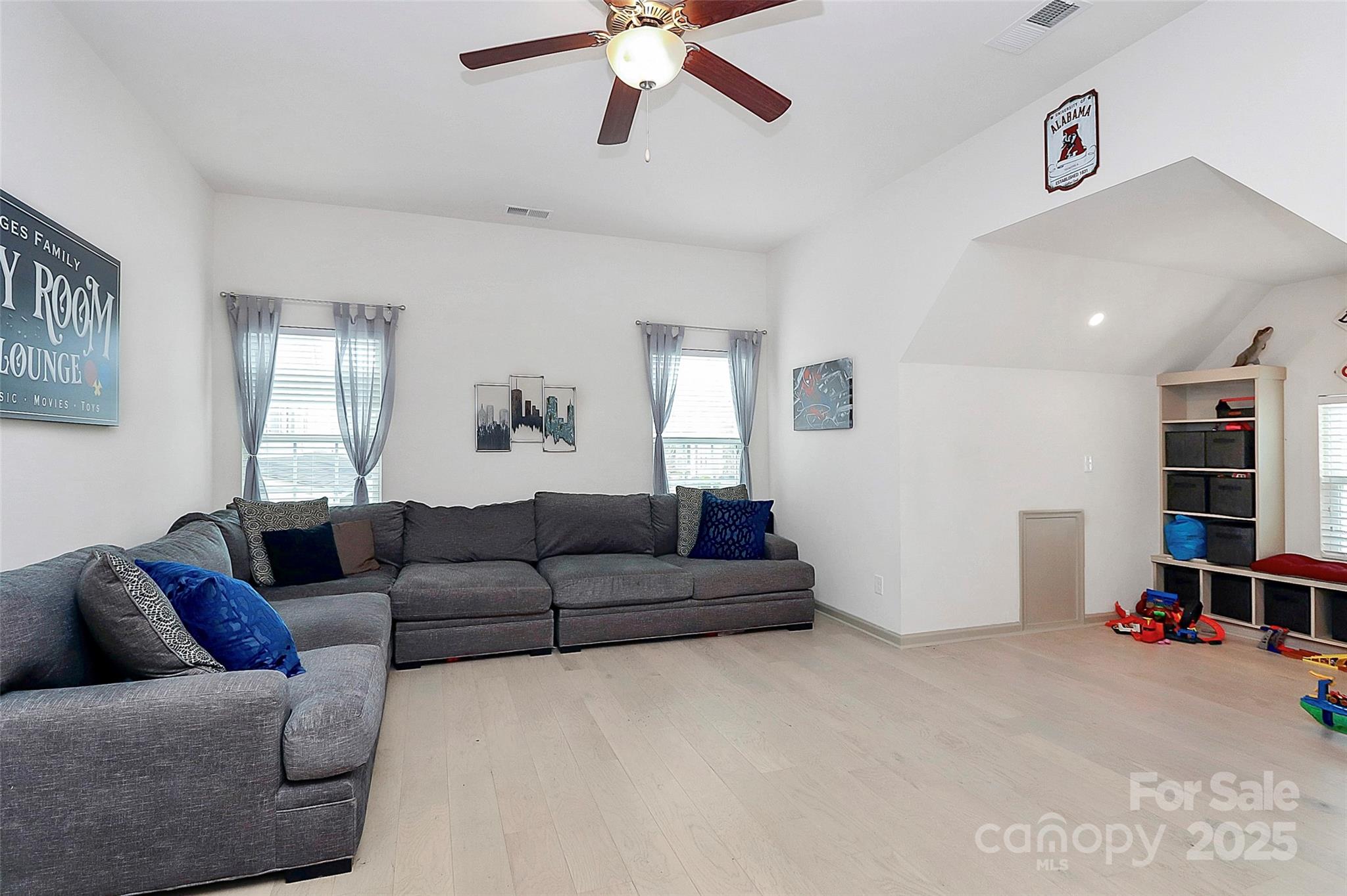 7362 Millstone Circle Southwest Concord, NC 28025 - Photo 37 of 45 a living room with furniture and a ceiling fan