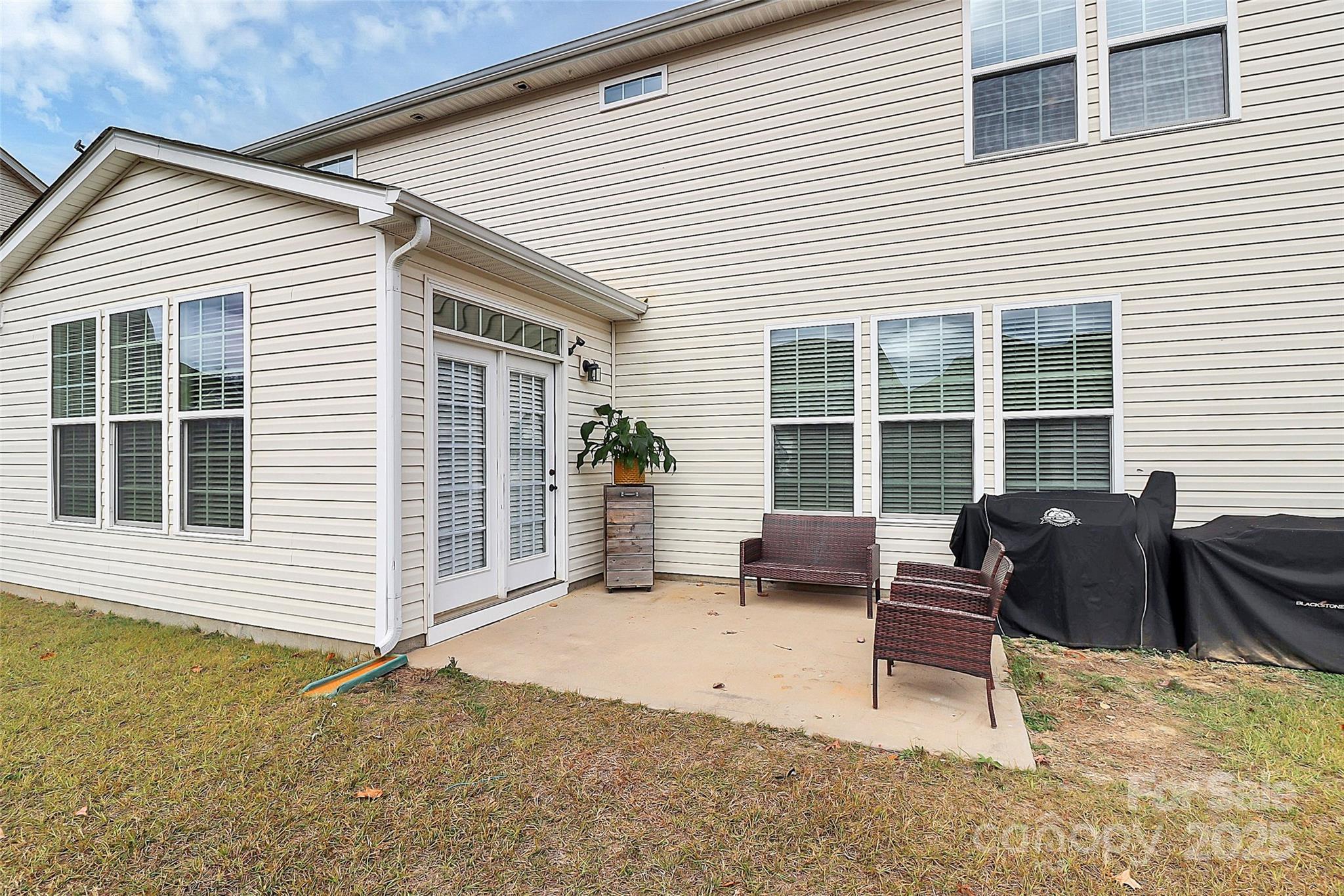7362 Millstone Circle Southwest Concord, NC 28025 - Photo 43 of 45 a view of a house with a patio and a yard