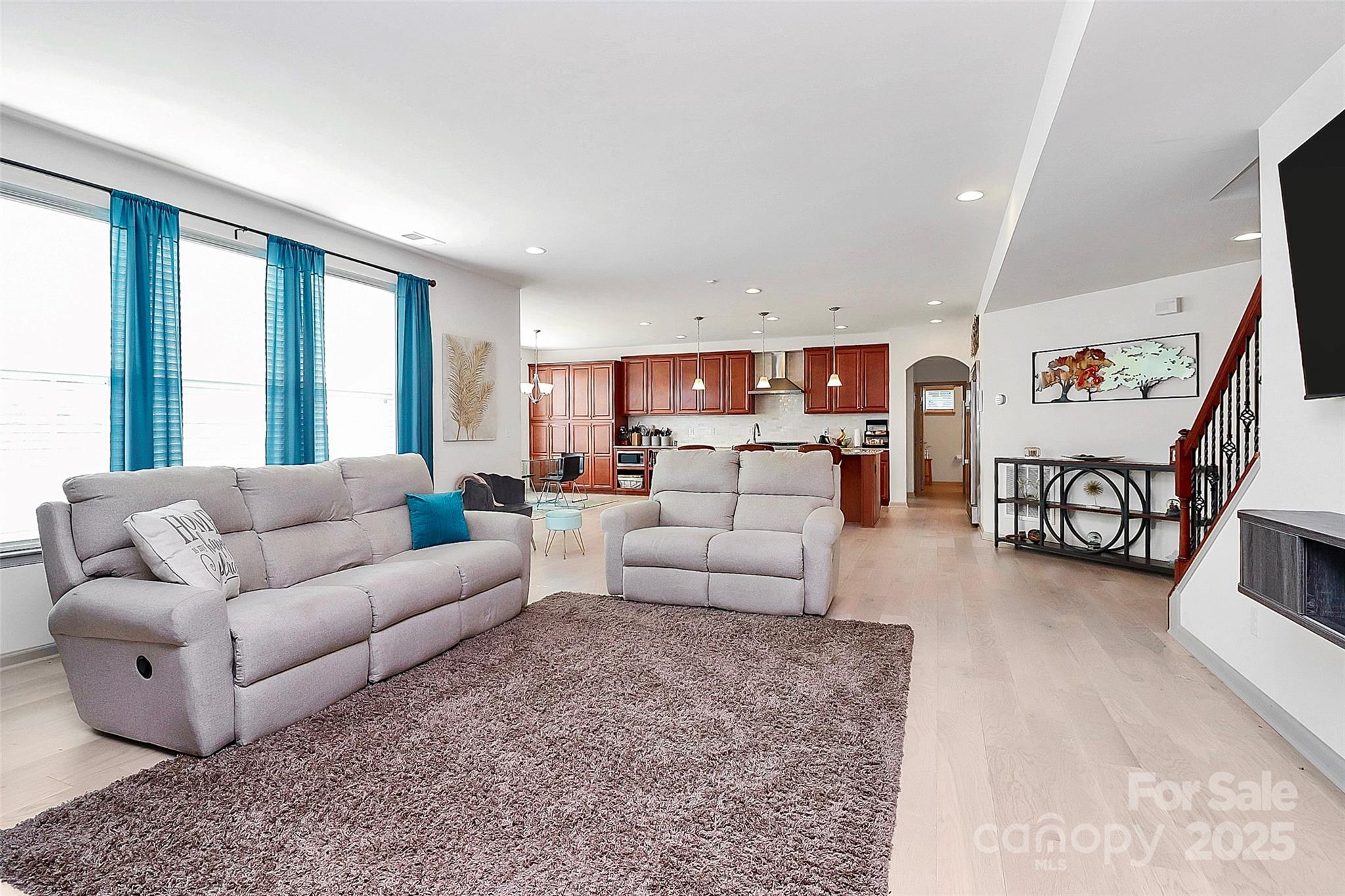 7362 Millstone Circle Southwest Concord, NC 28025 - Photo 8 of 45 a living room with furniture and wooden floor