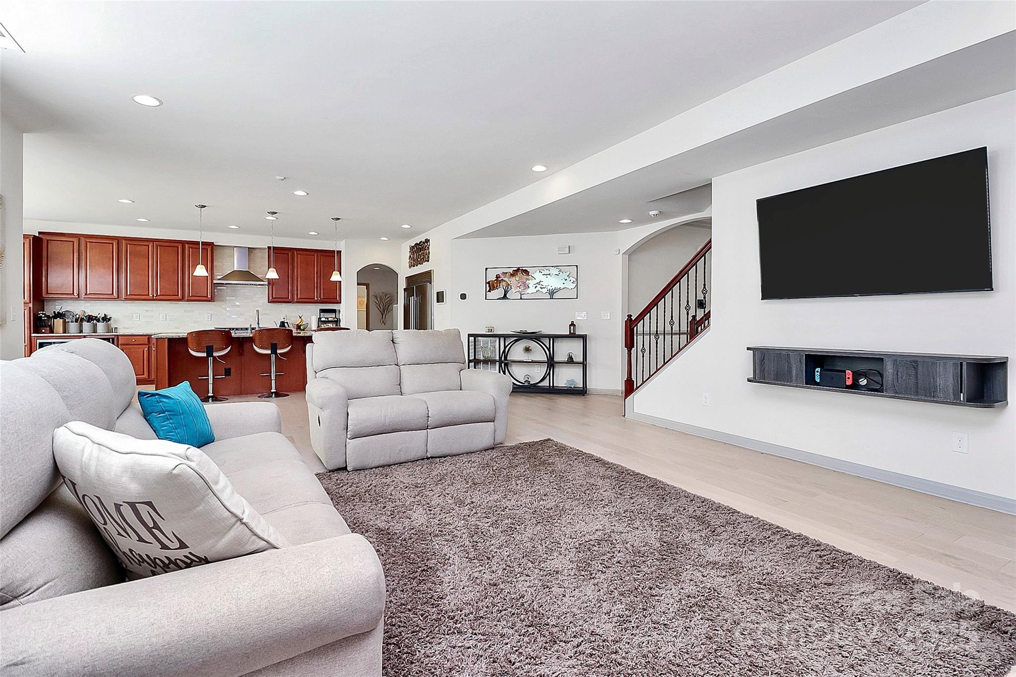 7362 Millstone Circle Southwest Concord, NC 28025 - Photo 9 of 45 a living room with furniture and a flat screen tv