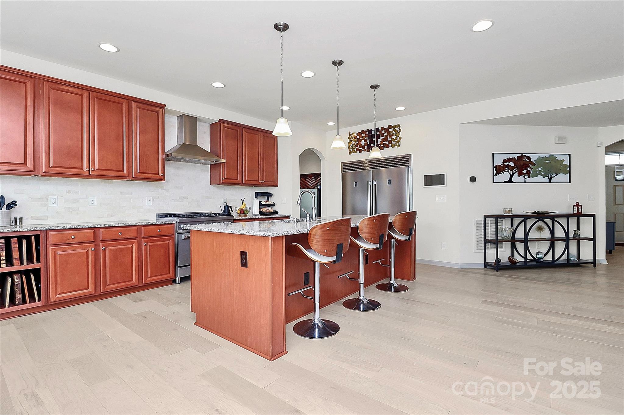 7362 Millstone Circle Southwest Concord, NC 28025 - Photo 10 of 45 a kitchen with stainless steel appliances granite countertop a stove a sink and a refrigerator