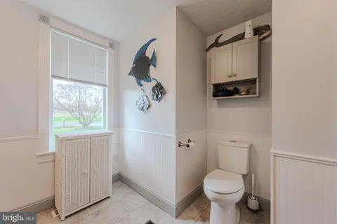 a view of walk in closet with clothes