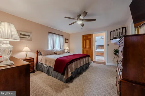 a bedroom with furniture and a bed