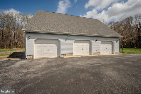 a outdoor living space with furniture and a fireplace