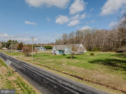 a view of a pool table and chairs