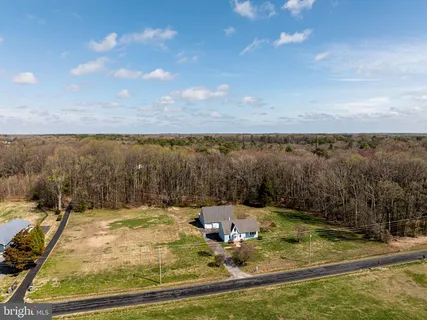 a view of a swimming pool with a yard