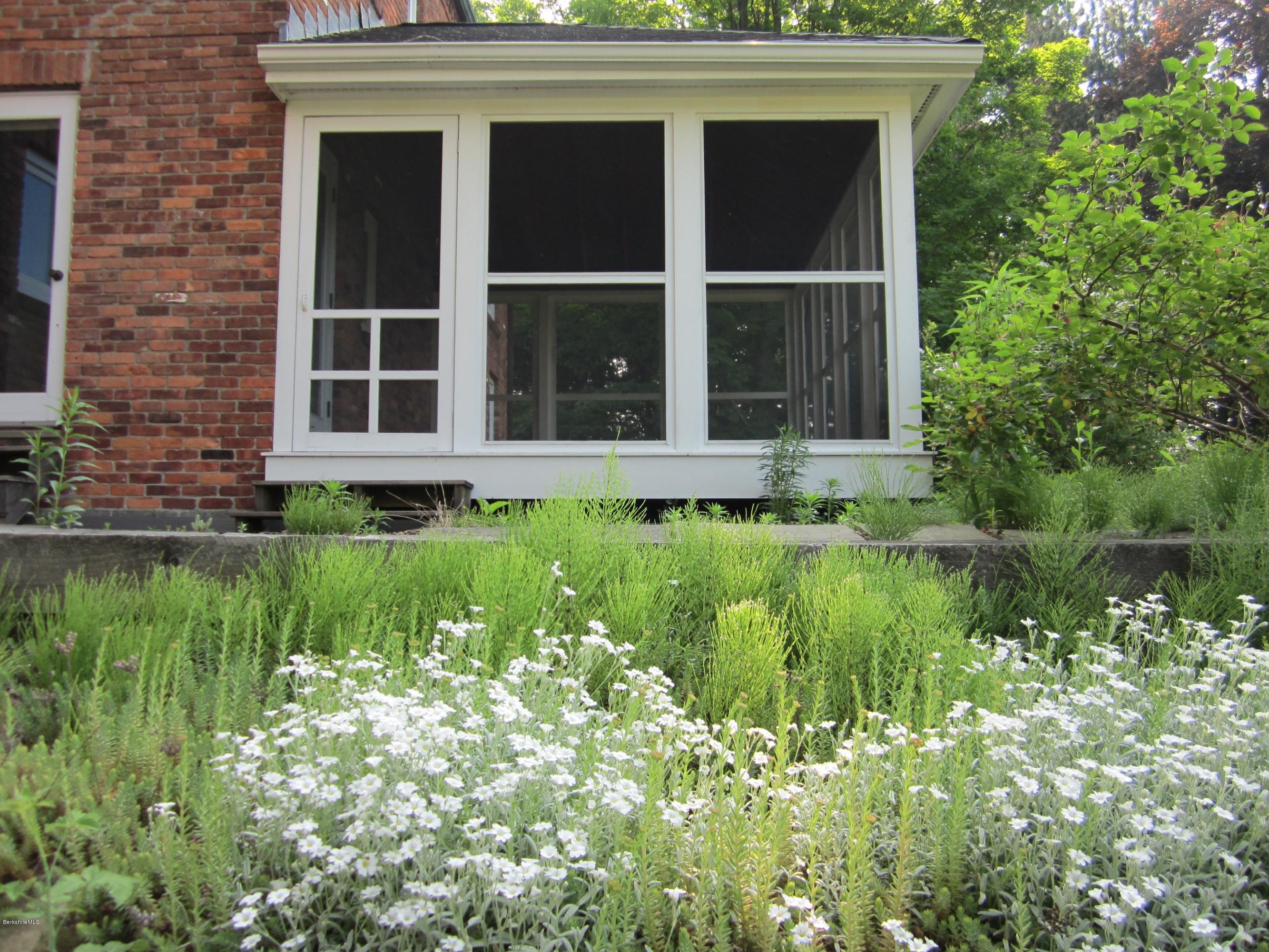 190 Main Road Monterey, MA 01230 - Photo 14 of 22 a house with a garden view