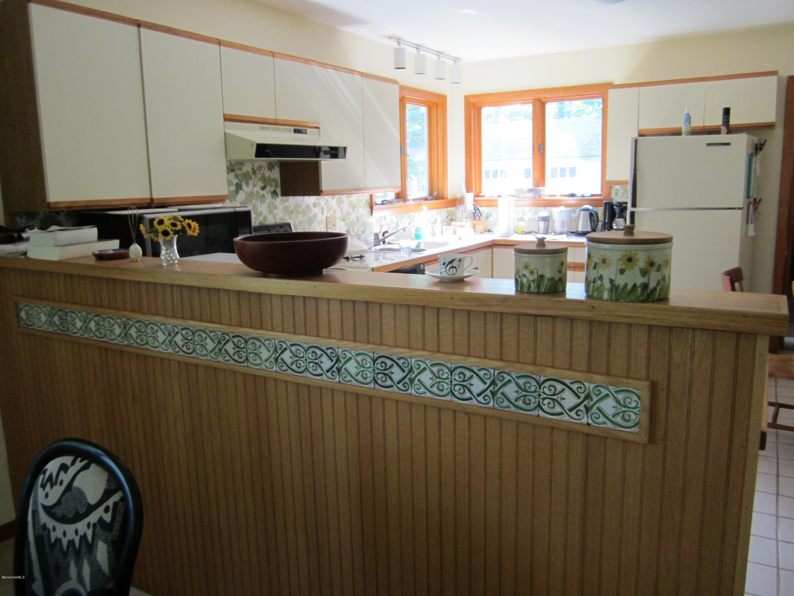 190 Main Road Monterey, MA 01230 - Photo 4 of 22 a kitchen with a refrigerator a stove and a sink