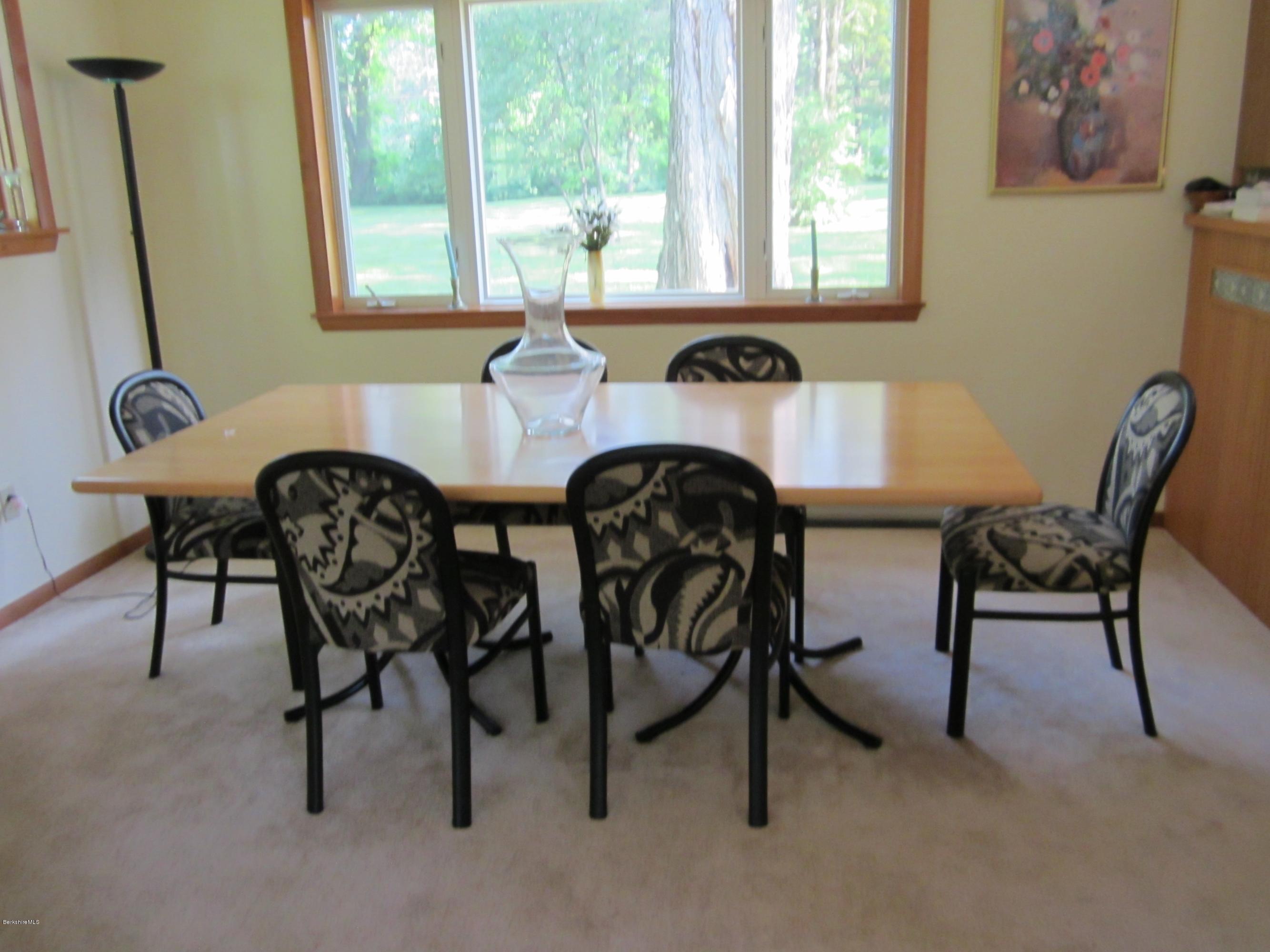 190 Main Road Monterey, MA 01230 - Photo 5 of 22 a view of a dining room with furniture and windows