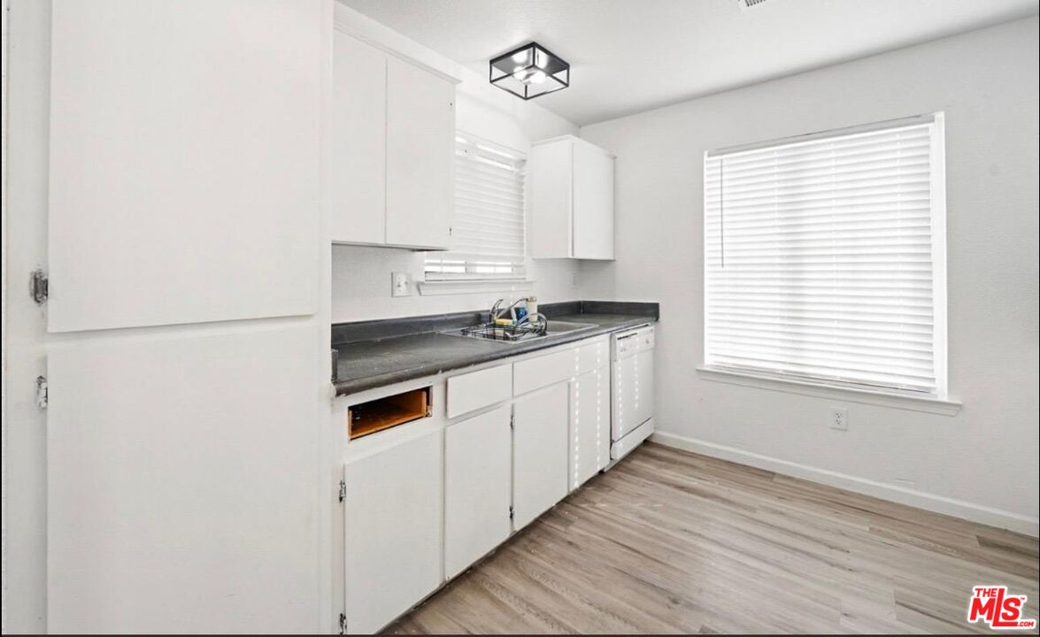 5612 McKee Road Bakersfield, CA 93313 - Photo 11 of 22 a kitchen with stainless steel appliances a refrigerator sink and cabinets