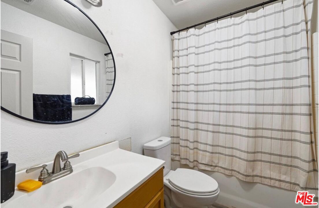 5612 McKee Road Bakersfield, CA 93313 - Photo 19 of 22 a bathroom with a sink toilet and shower