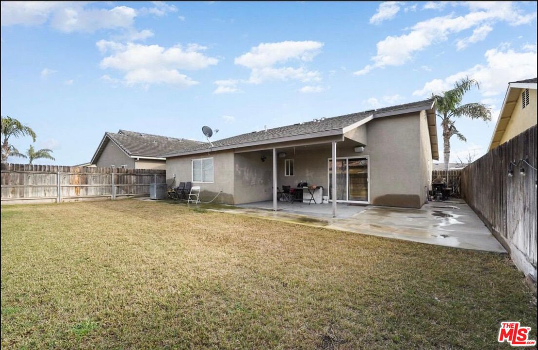 5612 McKee Road Bakersfield, CA 93313 - Photo 22 of 22 a front view of a house with a garden and yard