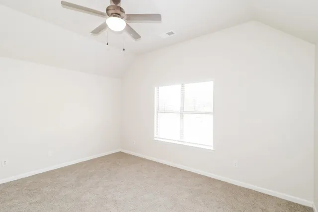 a kitchen with a stove and a refrigerator