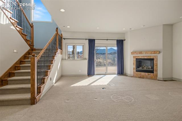 5510 Wilson Road Colorado Springs, CO 80919 - Photo 21 of 44 Family room in basement with fireplace.