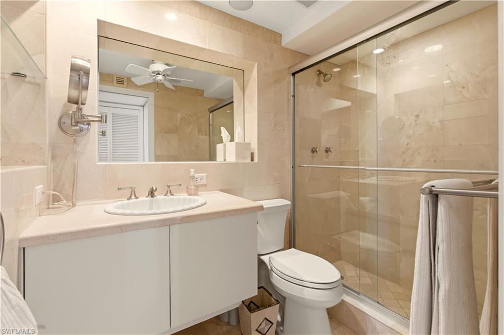 15 Bluebill Avenue, Unit 702 Naples, FL 34108 - Photo 17 of 23 Guest Bathroom