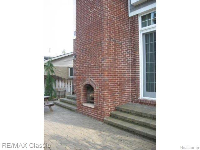 530 West 3rd Street Rochester, MI 48307 - Photo 18 of 18 Cozy Exterior Fireplace