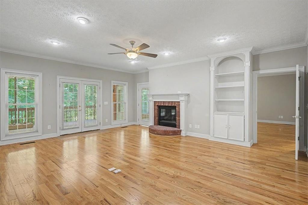 1136 Cole Lake Road Dallas, GA 30157 - Photo 15 of 72 a view of an empty room with a window and wooden floor