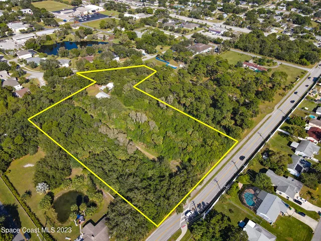 an aerial view of lake and residential houses