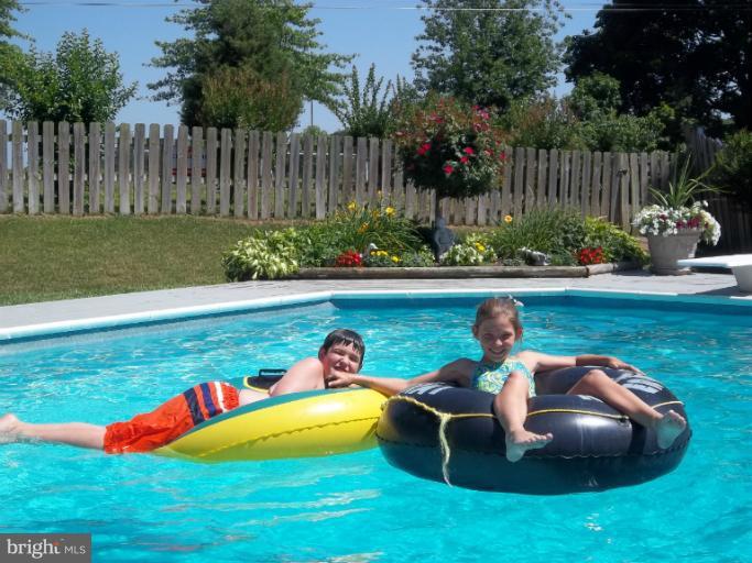 4825 Vicky Road Nottingham, MD 21236 - Photo 22 of 24 a view of a swimming pool and lounge chair