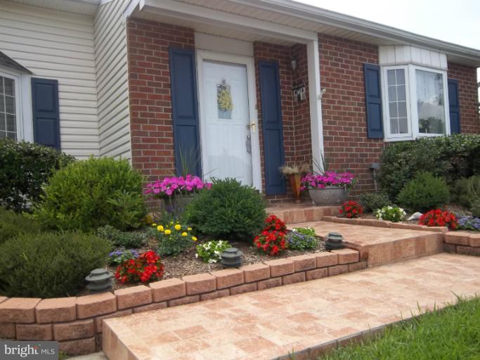 4825 Vicky Road Nottingham, MD 21236 - Photo 8 of 24 a view of a potted flower in front of a house