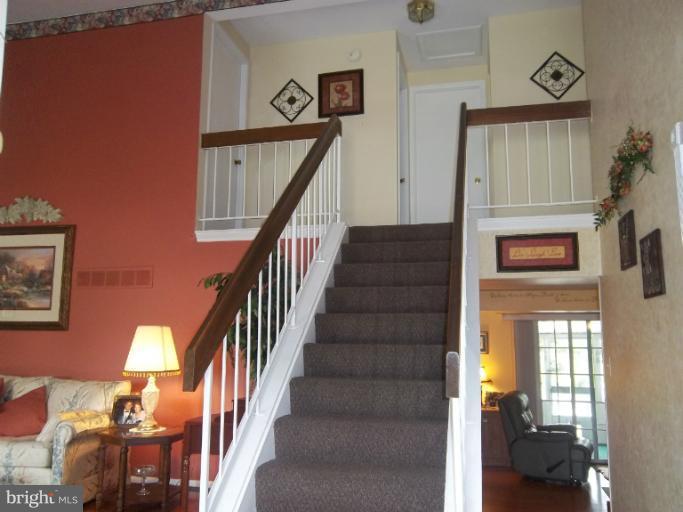 4825 Vicky Road Nottingham, MD 21236 - Photo 9 of 24 a view of entryway and hall with a wooden floor