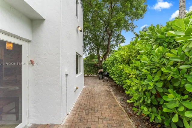 a spacious bathroom with a granite countertop sink a toilet and shower