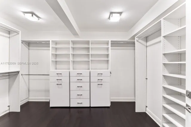 a bathroom with a sink mirror toilet and shower