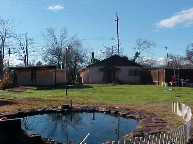17972 Oasis Road Redding, CA 96003 - Photo 3 of 6 a front view of a house with a yard