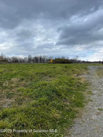 a view of a yard with an outdoor space