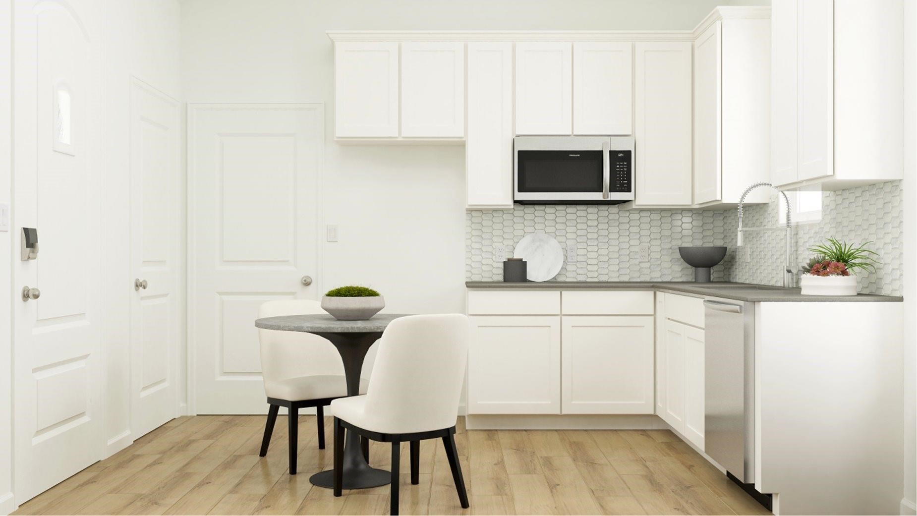 2703 Pine Bluff Drive Rosenberg, TX 77469 - Photo 19 of 24 a kitchen with a sink cabinets and wooden floor