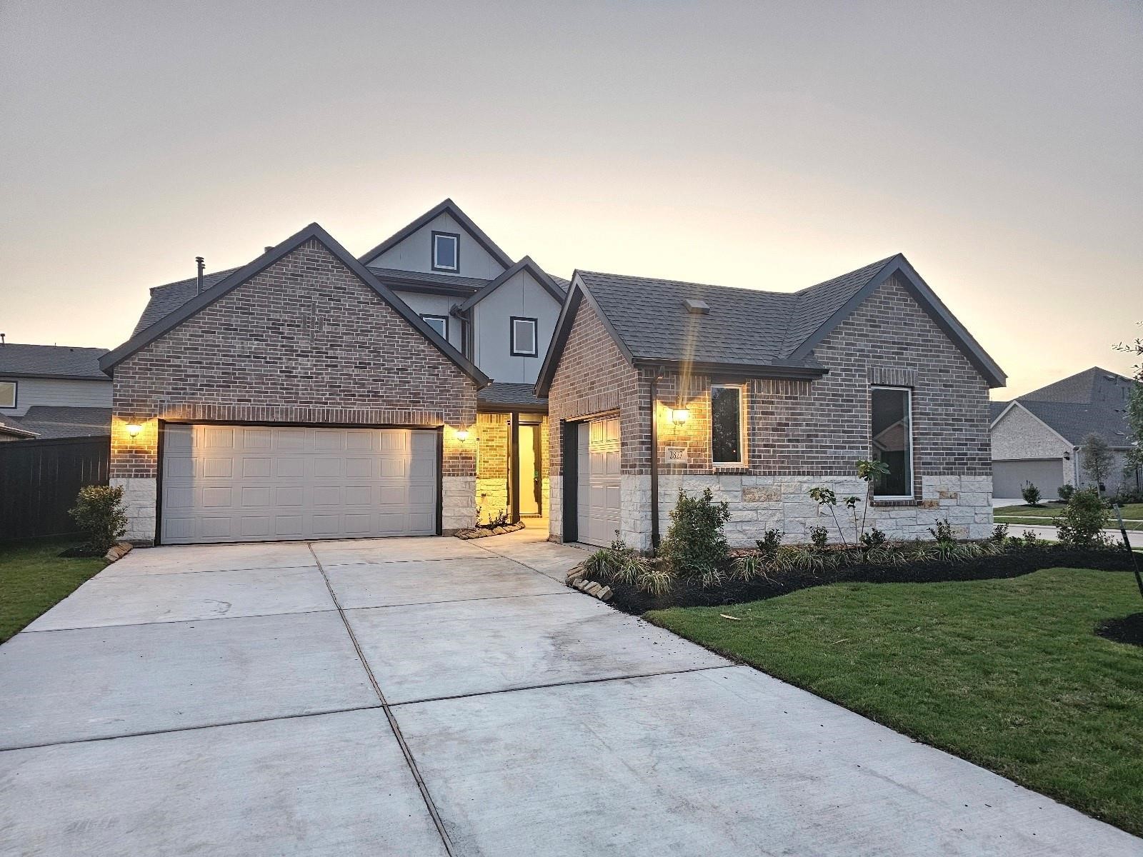 2703 Pine Bluff Drive Rosenberg, TX 77469 - Photo 2 of 24 a front view of a house with a yard and garage