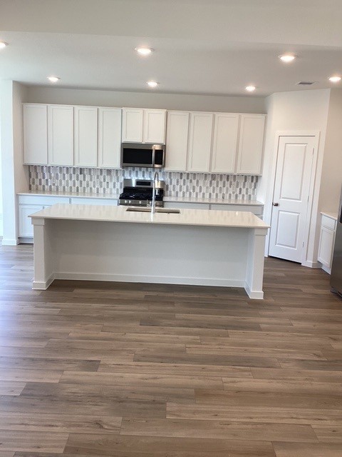 2703 Pine Bluff Drive Rosenberg, TX 77469 - Photo 4 of 24 a view of kitchen with granite countertop stainless steel appliances sink and cabinets