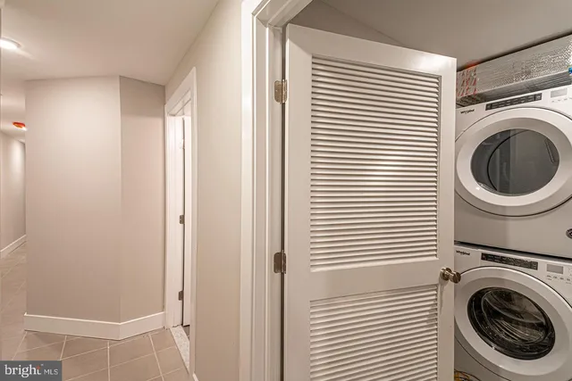 a view of a hallway with washer and dryer