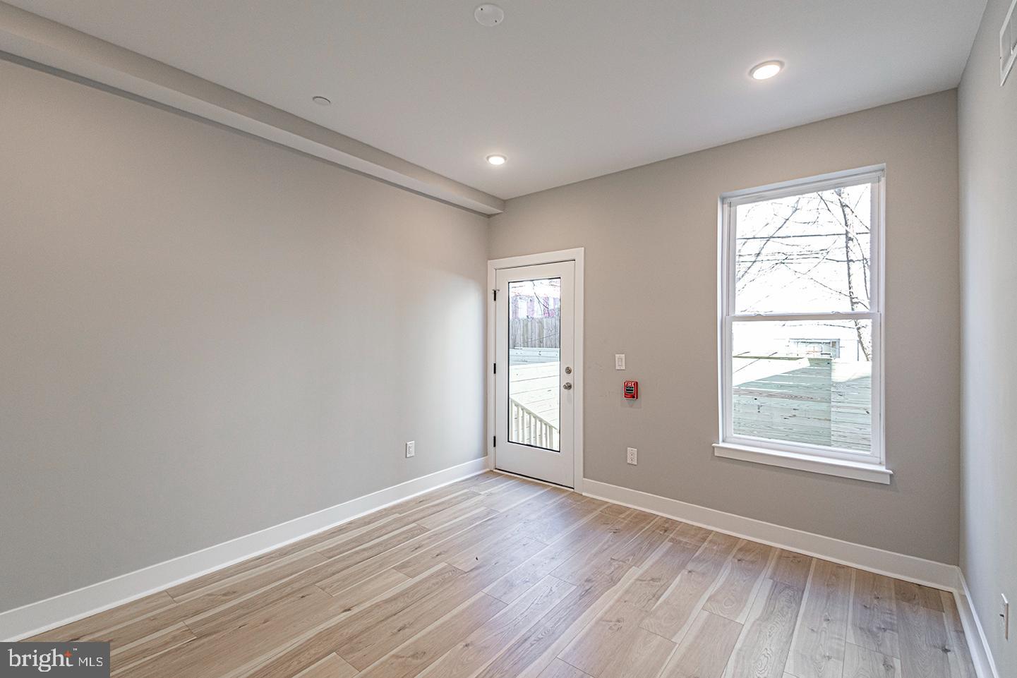 715 South 51st Street, Unit 1 Philadelphia, PA 19143 - Photo 3 of 18 a view of empty room with wooden floor and fan