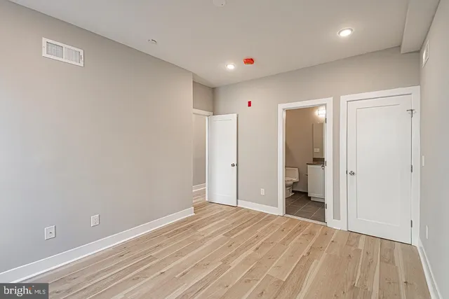 a view of a room with a closet and a bathroom