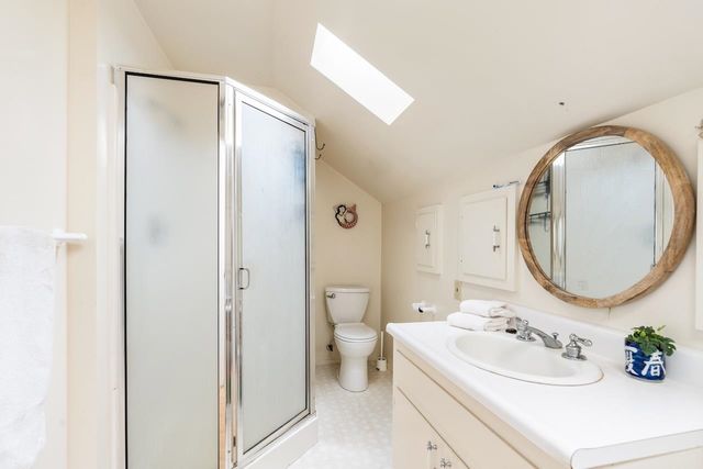 a bathroom with a sink toilet and mirror