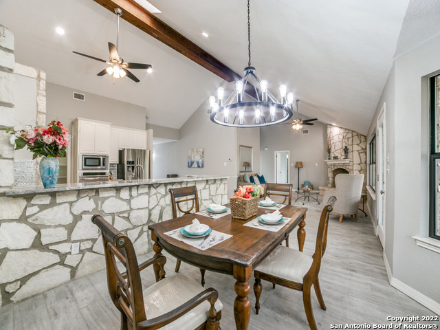 2580 Goat Hill Road Lakehills, TX 78063 - Photo 14 of 34 a view of a dining room with furniture wooden floor and chandelier