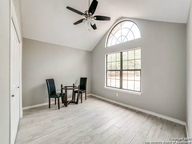 a view of a livingroom with furniture and a window