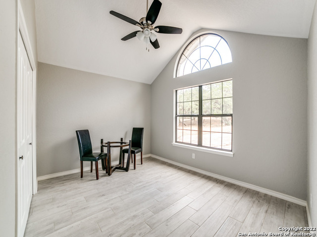 2580 Goat Hill Road Lakehills, TX 78063 - Photo 20 of 34 a view of a livingroom with furniture and a window